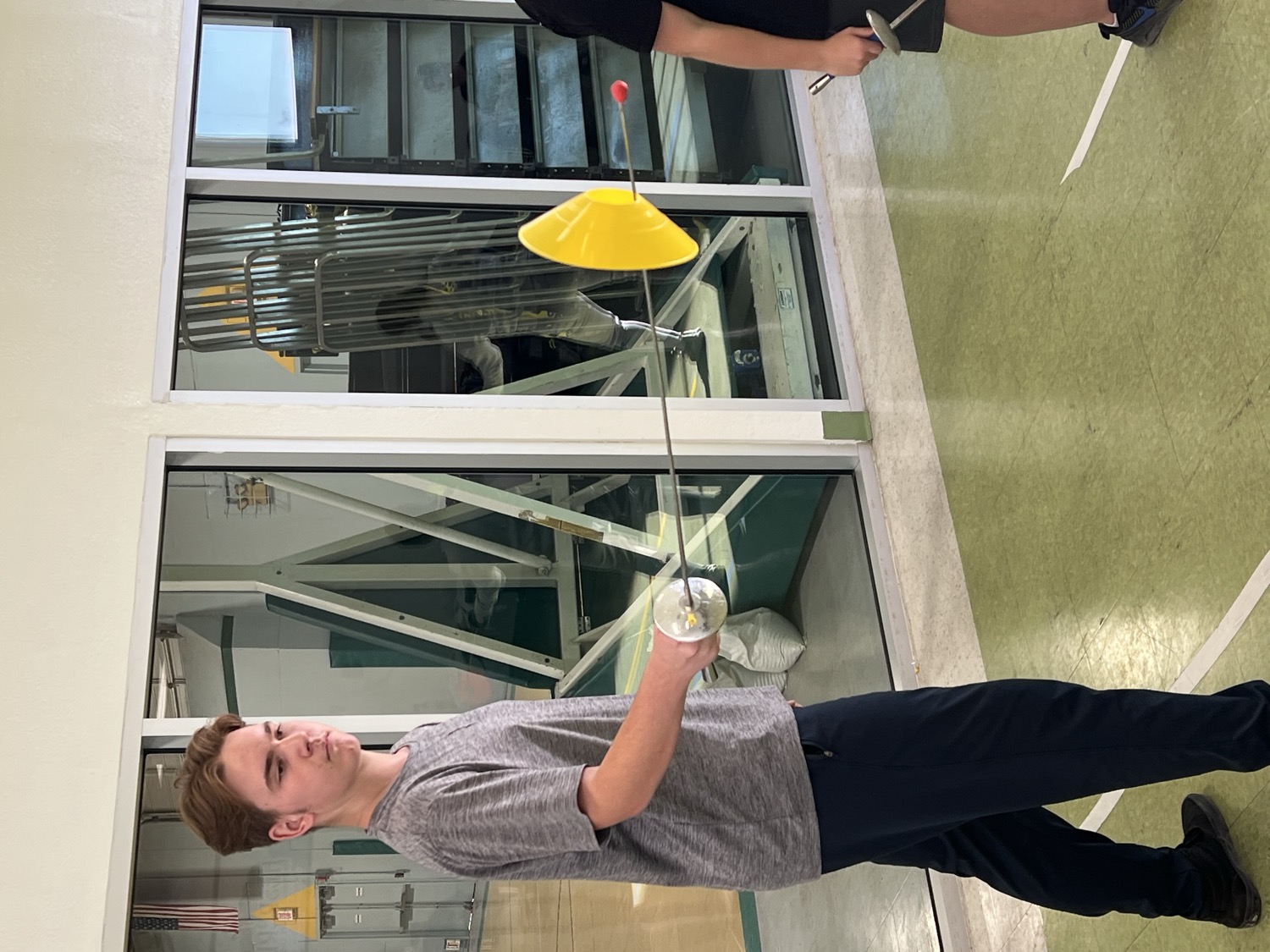 Young fencer focused on a point-control drill