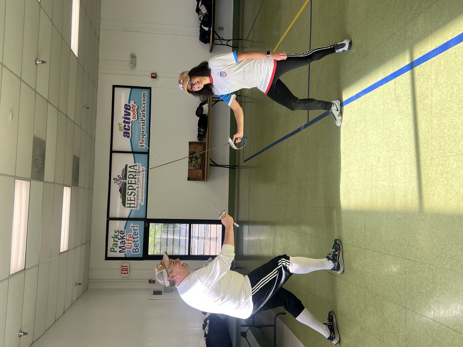 Coach and student in a live bout