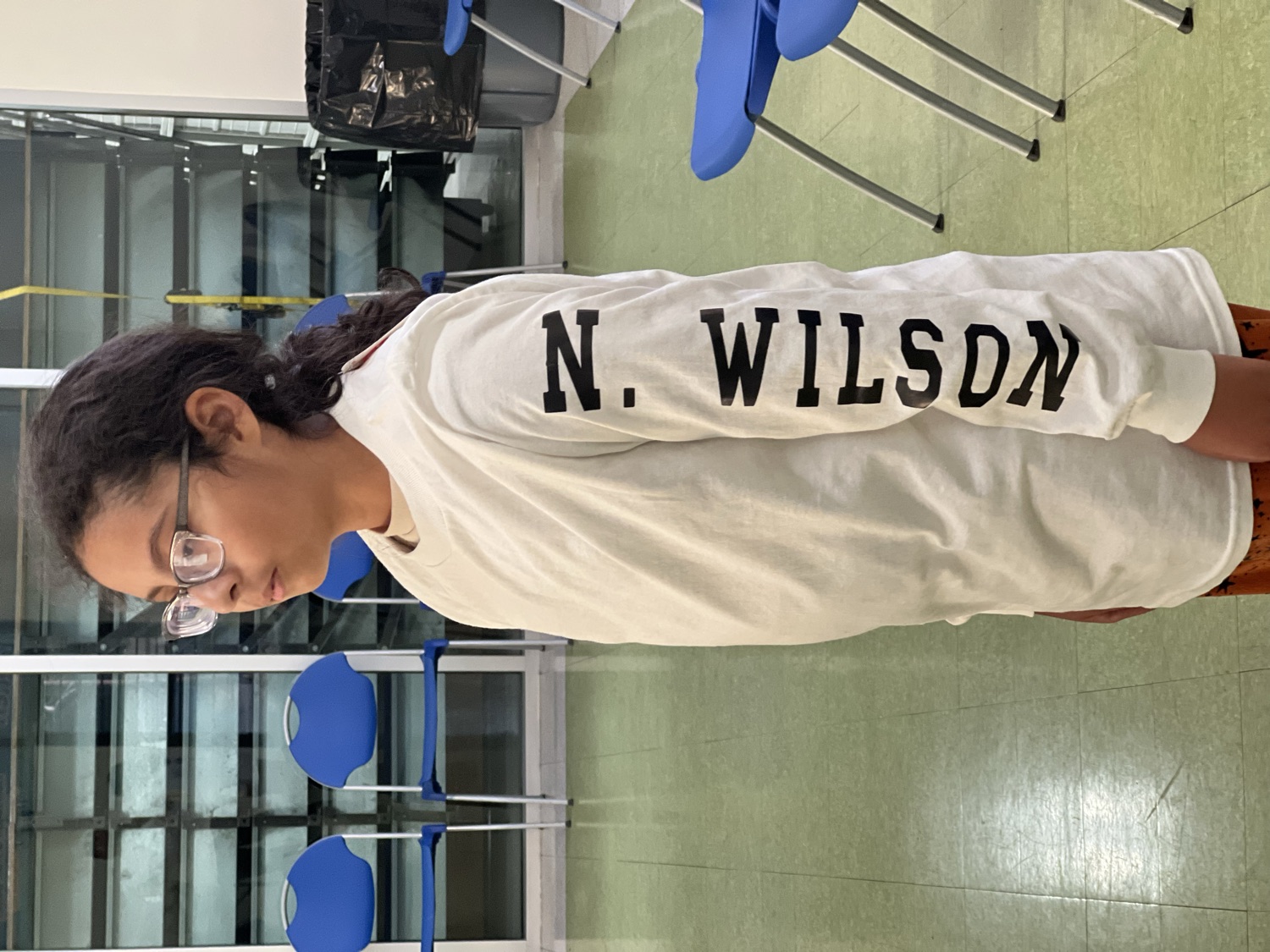 Athlete wearing a white Mojave Fencing long-sleeve tee with a name printed down the sleeve